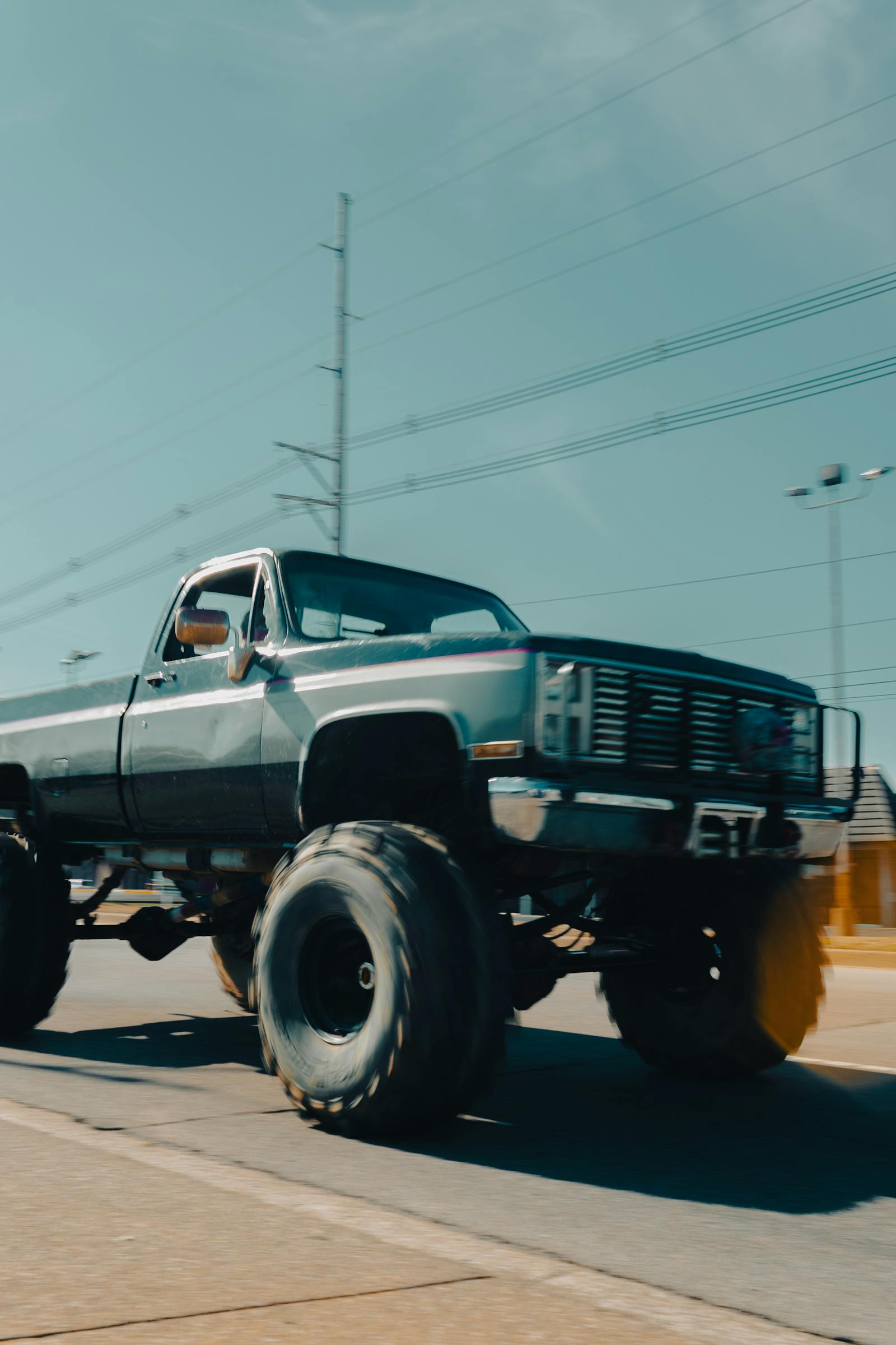 Lifted pickup truck with oversized off-road wheels